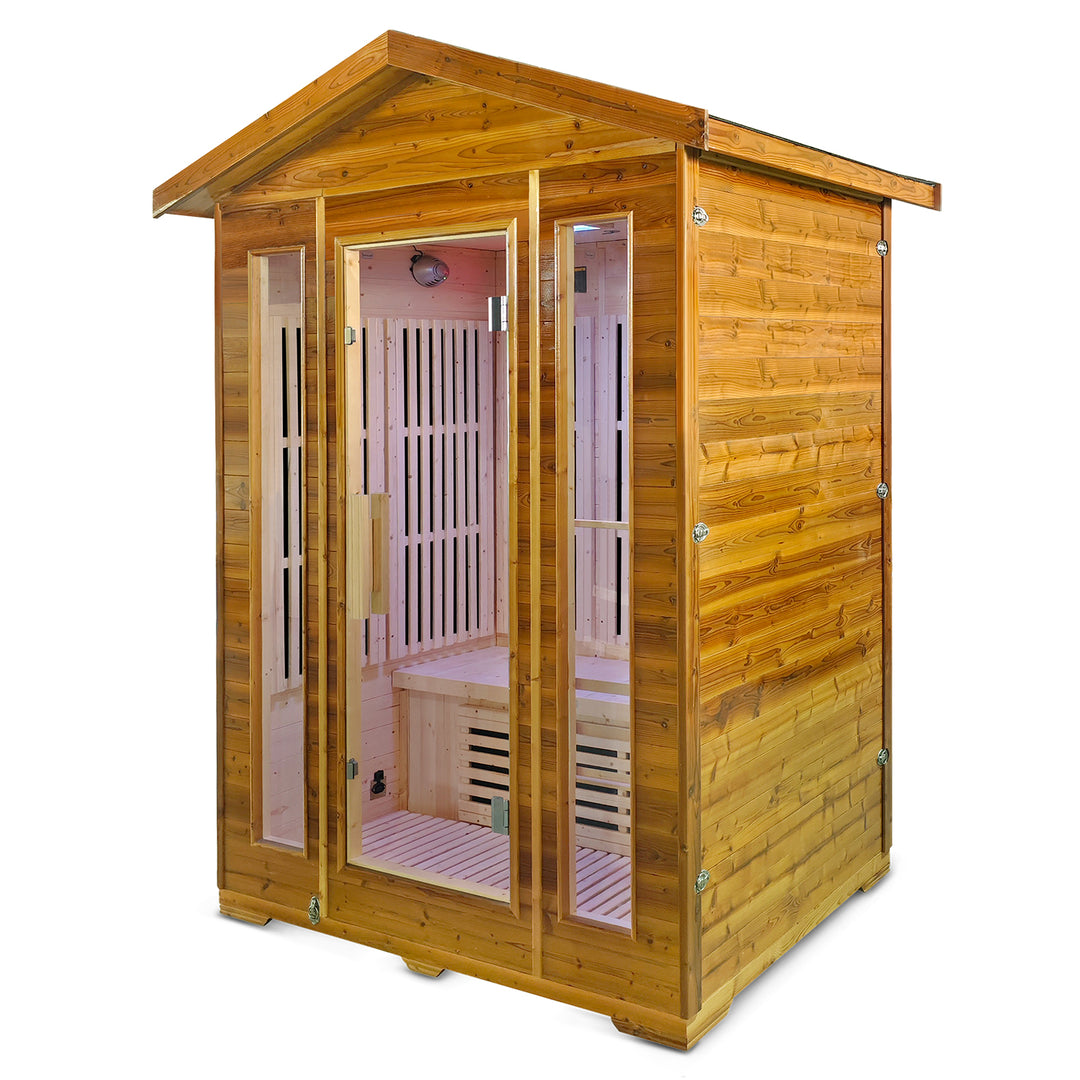 A wooden outdoor sauna cabin with a pitched roof, glass-paneled doors, visible wooden interior benches, and a pinkish-red infrared light glow inside, shown on a plain white background.
