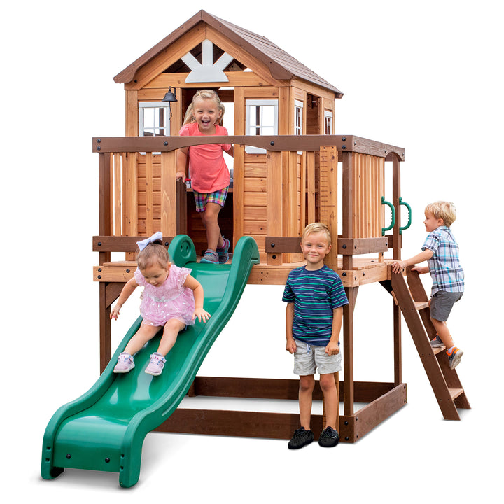 Elevated cubby house for kids in the backyard with slide and climbing wall